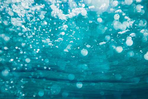 water underwater photography of water bubbles blue