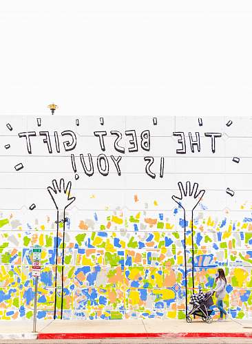 quote woman walking beside wall with the best gift is you graffiti art