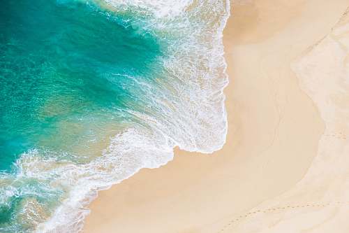 backgrounds aerial shot of seawaves beach
