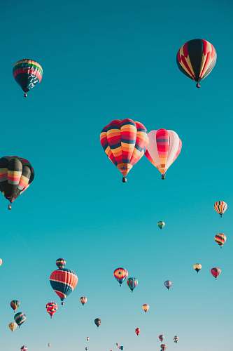 balloon assorted hot air balloons flying at high altitude during daytime backgrounds