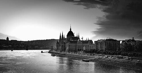 architecture grayscale photo of building near body of water building