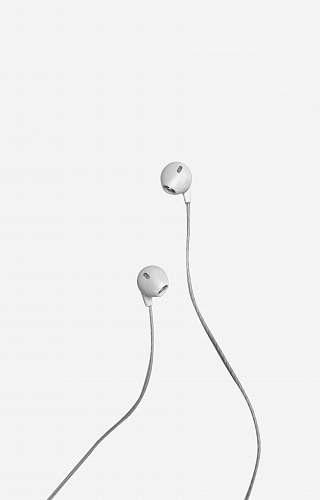 white white apple earpods on white background shower faucet