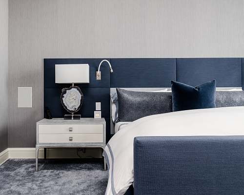 bedroom white and clear desk lamp on white wooden nightstand near bed bed