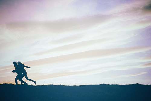 adventure person jumping on mountain during daytime leisure activities
