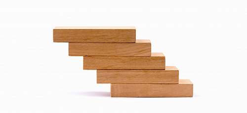 tabletop pile of brown wooden blocks furniture