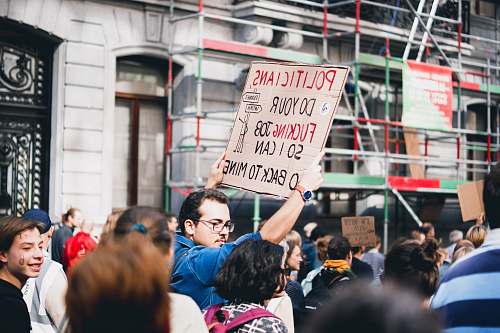person rally beside street human