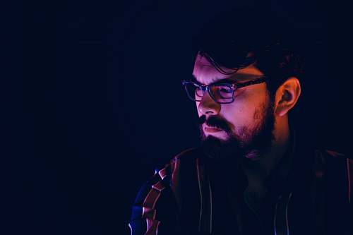 human man wearing black framed eyeglasses person