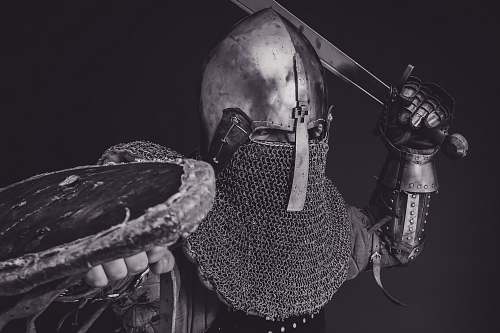 armor man with steel and chainmail armor holding sword grey