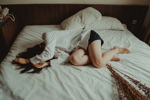 bed woman lying on bed depression