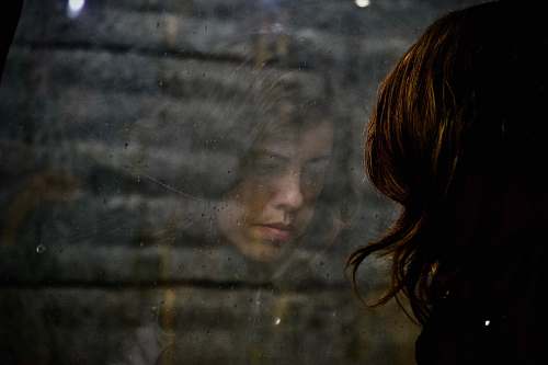 portugal woman looking at the floor glass