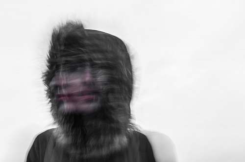blur Creepy blurred photo of a person's face and a furry hood head
