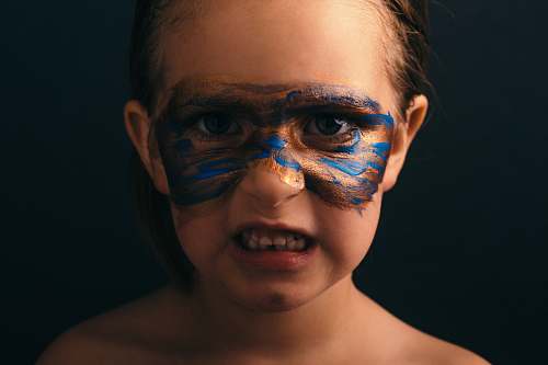 human girl wearing face paint portrait people