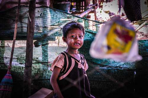 people selective focus photography of toddler inside mesh net human