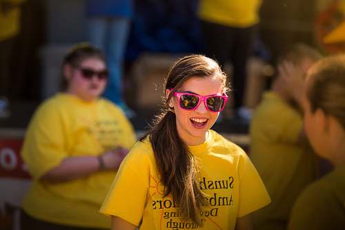 apparel smiling girl wearing pink framed sunglasses clothing