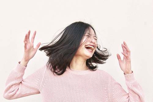 human smiling woman wearing pink sweater people