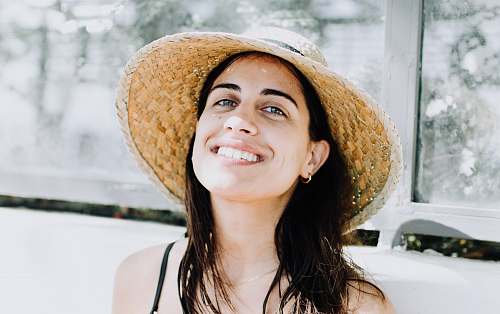 human woman wearing black strap top with sunhat people