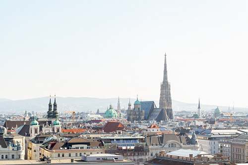 building city with high rise buildings during daytime spire