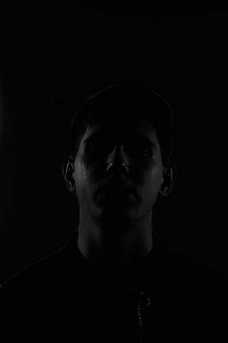 person man in black crew-neck shirt human