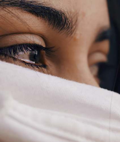 female shallow focus photography of woman's eyes eyes