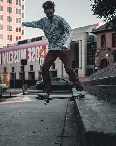 human man playing skateboard on staircase person