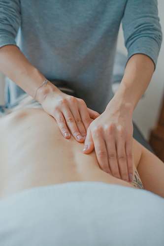 human man massaging woman's body massage