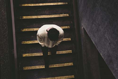 urban man walking on staircase city