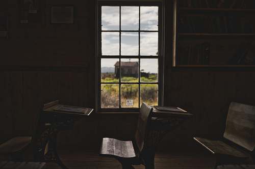 wood brown wooden desks and clear glass window fort rock