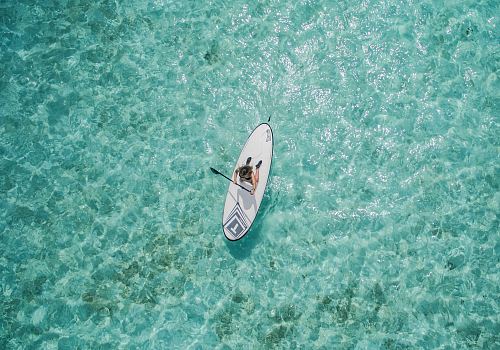 aerial photo of person using paddleboard