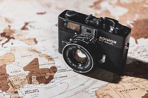 black Konica SLR camera on map
