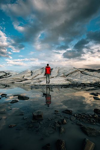 man standing near body of water of water