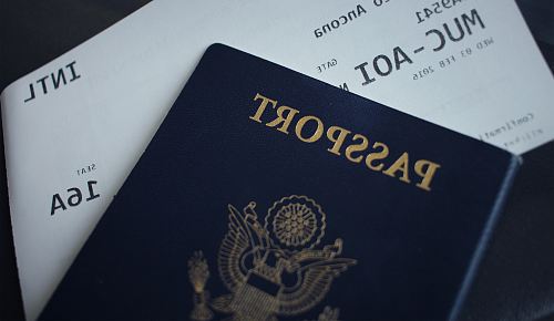 passport booklet on top of white paper