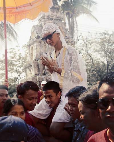 accessory man riding on man's shoulder sunglasses