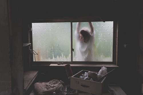 box woman leaning on window storage
