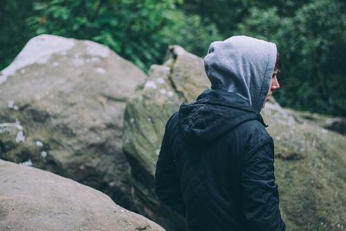 person person in black hoodie near gray rocks united kingdom