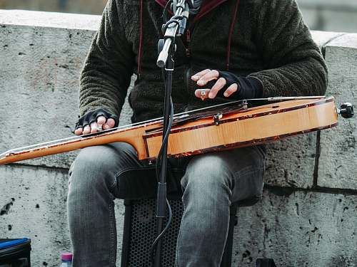person person playing guitar white singing musical instrument
