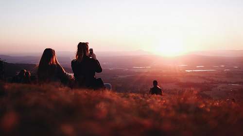 person two person sitting on field nature