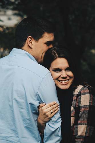 people woman holding arms of man person