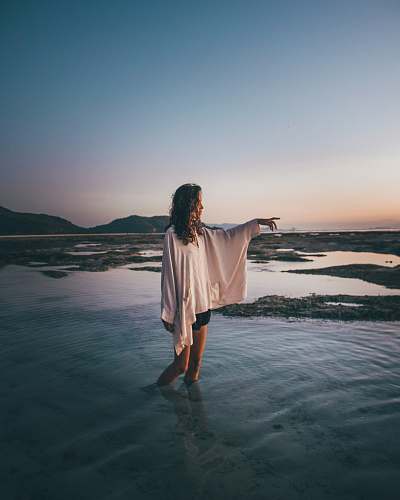 clothing woman wearing white blouse standing on water apparel