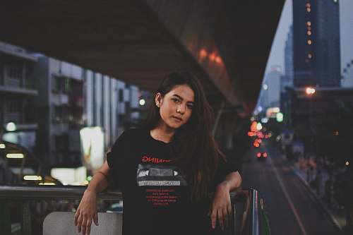 human woman leaning on balcony frame people