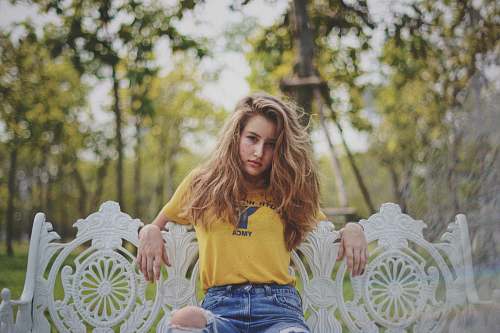 human woman sitting on patio bench outdoor people