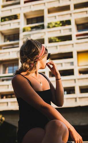 human woman wearing black spaghetti strap top clothing
