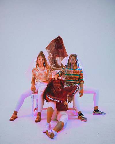 orlando four person sitting on chair with plastic bag covering their heads united states