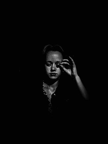 human grayscale photo of woman face
