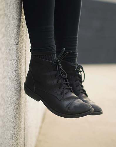 shoe person wearing black lace-up boots clothing