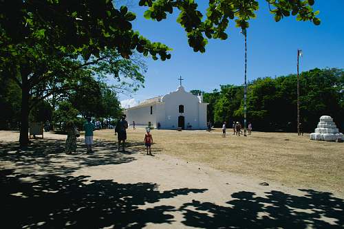 person white cathedral at daytime grass