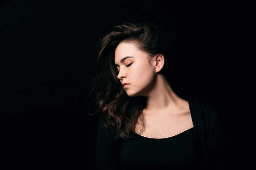 person woman wearing black crew-neck shirt human