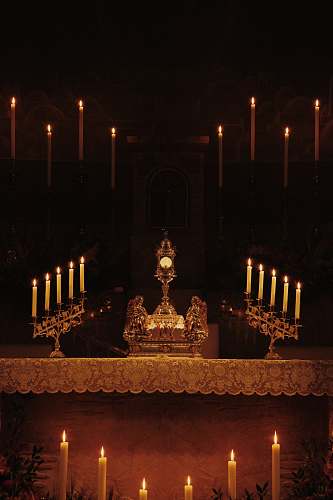 altar lighted candles inside building church
