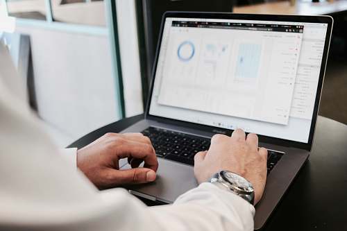 shirt person using MacBook Pro businessman