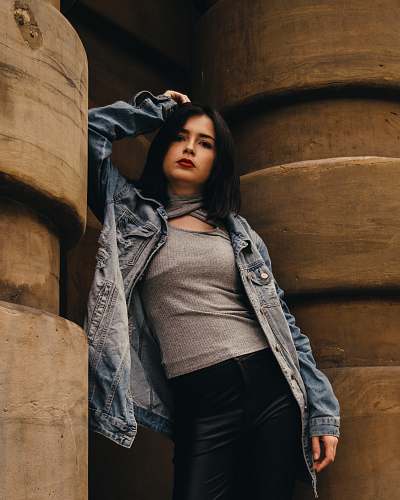 sleeve woman leaning on wall clothing
