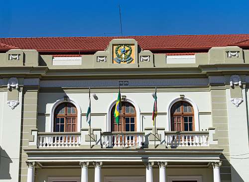 window hanged flags on balcony city hall